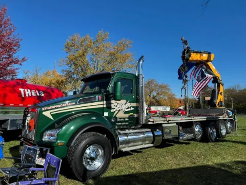 Stiger Precast green straight truck.