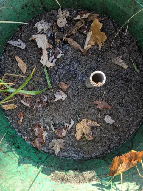 view looking down an open riser on a septic tank